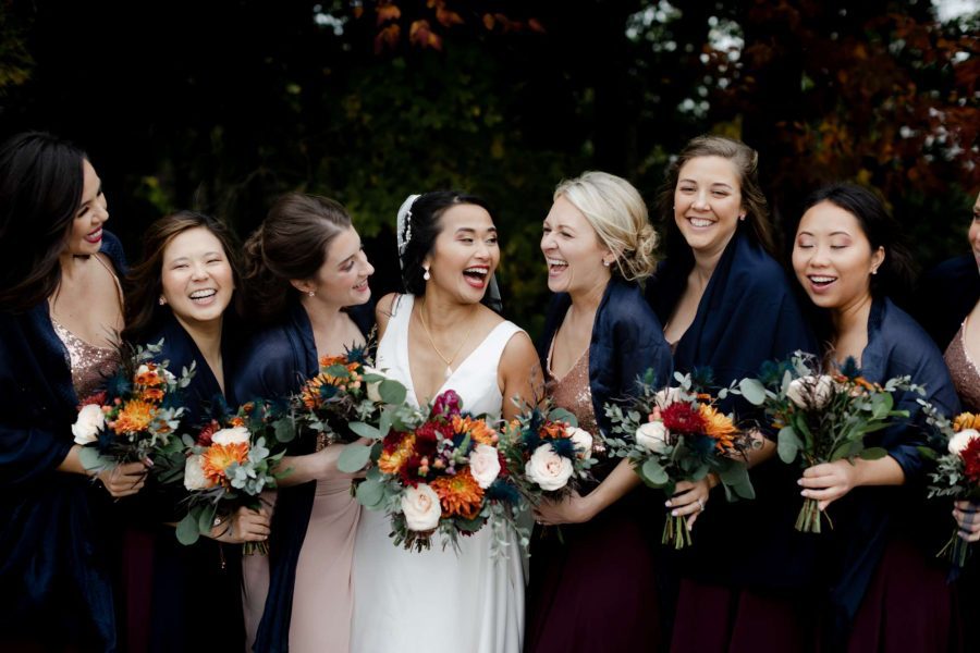 Bride and her bridesmaids with bouquets