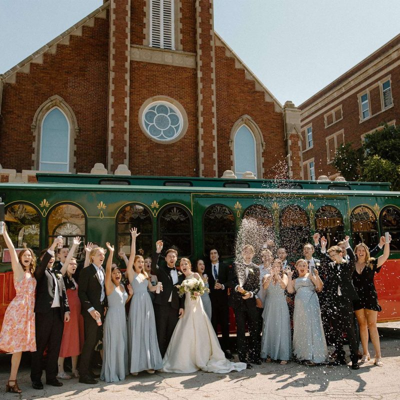 Wedding party pose by Lamers Trolley
