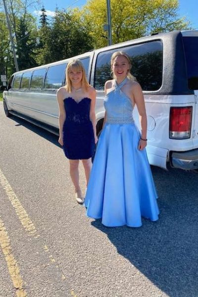 prom attendees pose by Interior of limo bus a vehicle from Prestige & Executive Limousines