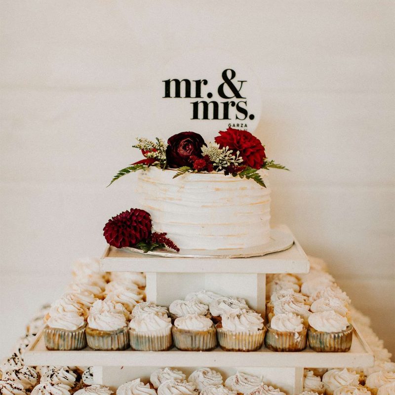 Mr. & Mrs. Garza sign by cake & cupcake display by The Cupcake Couture