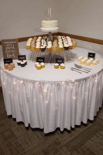 Sweets table with cupcakes and single tier wedding cake