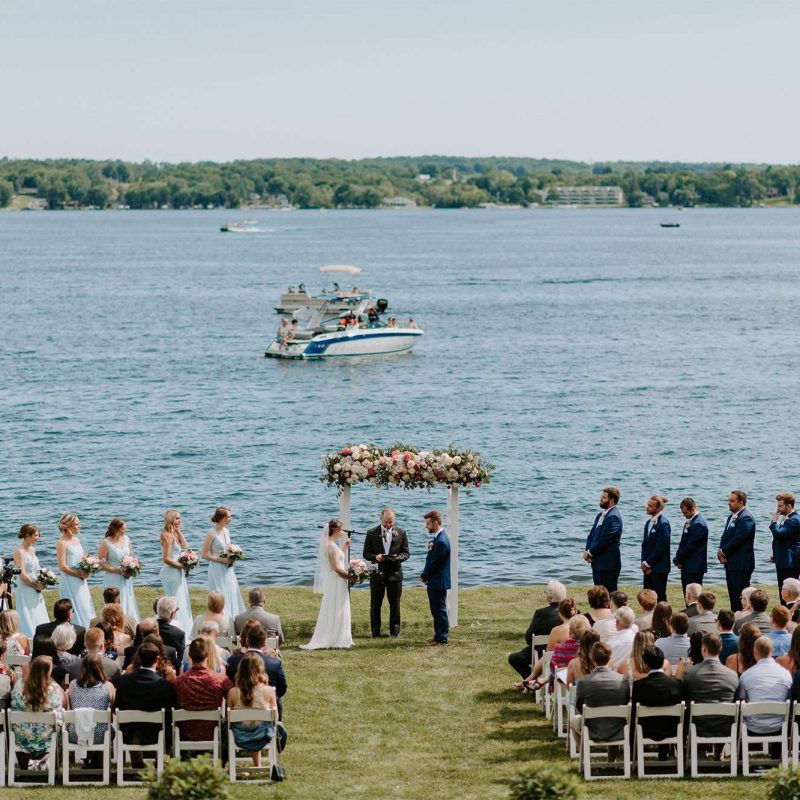 Beautiful lakeside wedding ceremony at Heidel House Hotel in Green Lake