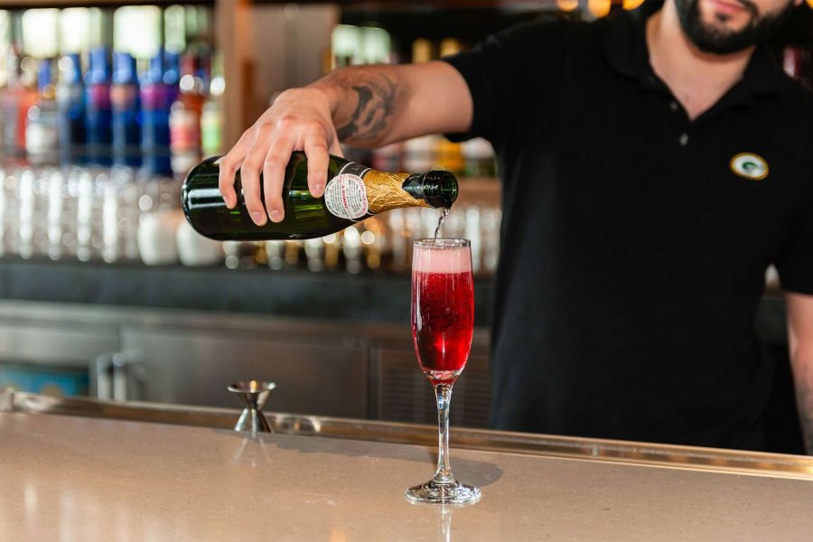 Bar Tender pouring Champagne