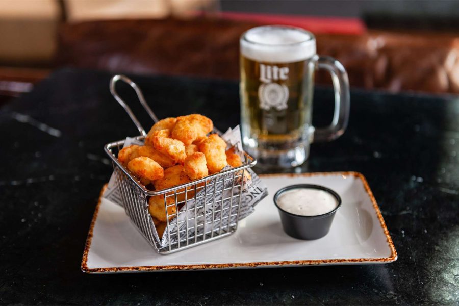 Cheese curds on a platter with a beer The Turn Green Bay, WI