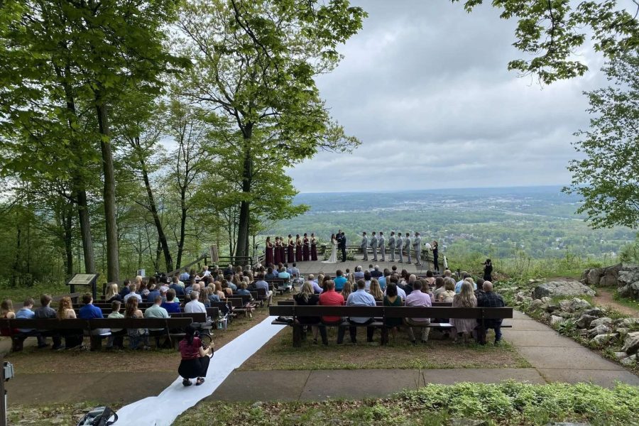 Wedding ceremony on hill with overlook