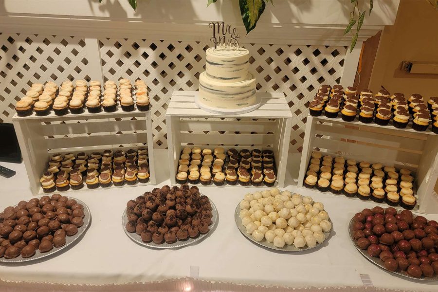 Green Bay dessert table with cupcakes, cake, and cake balls.