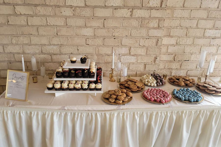 Dessert table with cupcakes, cookies, and cake balls from the Cupcake Couture.